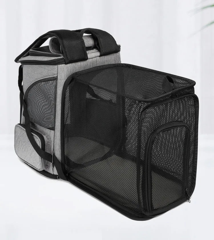 Grey breathable pet carrier backpack with expandable mesh front for ventilation and waterproof fabric, side view.