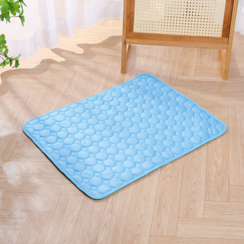 Blue KIRE™ Glacier-Touch cooling mat placed on wooden floor - Minimalist design for modern homes