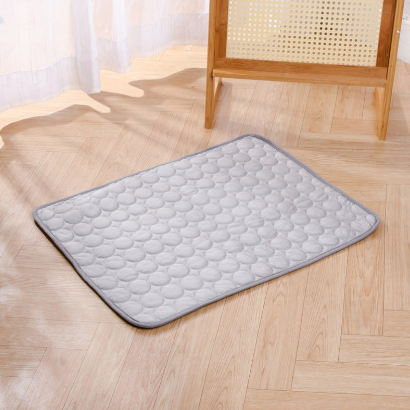 Gray KIRE™ Glacier-Touch cooling mat placed on wooden floor - Minimalist design for modern homes