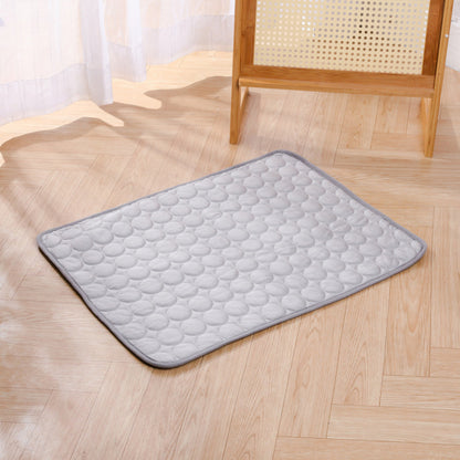 Gray KIRE™ Glacier-Touch cooling mat placed on wooden floor - Minimalist design for modern homes