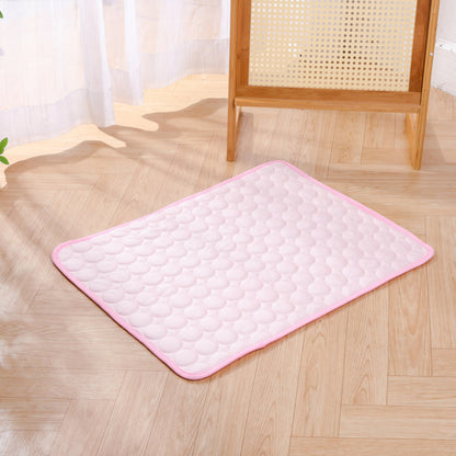 Pink KIRE™ Glacier-Touch cooling mat placed on wooden floor - Minimalist design for modern homes